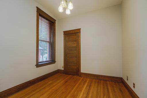 Bedroom 1 - Den option - with hardwood floors, raised millwork and SOLID SOLID SOLID 6-panel doors!