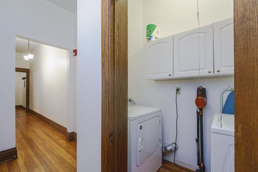There is in-suite laundry with cabinetry and a gas dryer, conveniently located in the hall.