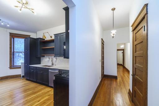 Two additional bedrooms, a FULL bathroom and the laundry are down the hall.