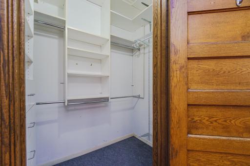 The primary bedroom is generous and has a walk-in closet with custom organizers.