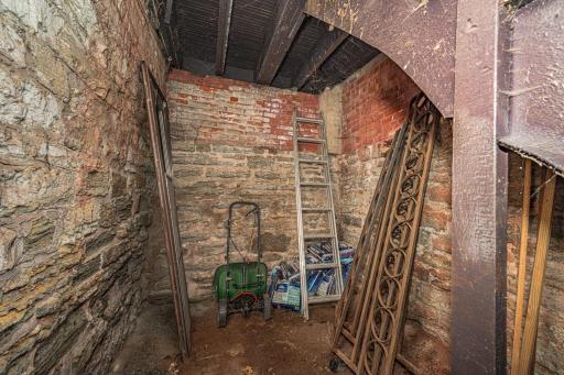 The lower level of the building offers storage space for the residents, including a private room for this unit.
