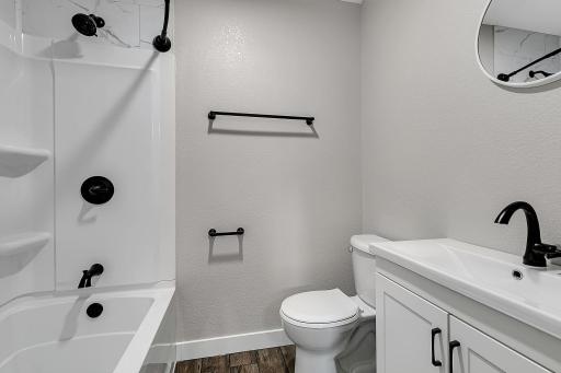 The private primary full ensuite bathroom features all new finishes.