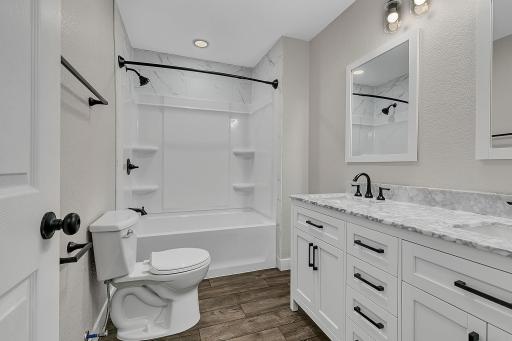The full bathroom on the main floor features a double vanity.