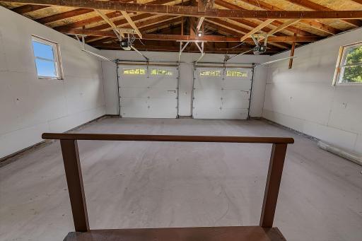 The attached 2 stall garage features a brand new (2026) concrete floor. New insulation, plastic, and drywall was also added in 2026.