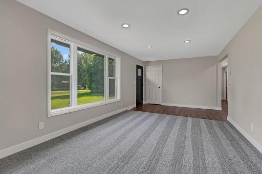 Enjoy view of the front yard through the large picture window. A coat closet is conveniently located near the front door.