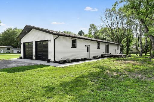 A new roof (shingles and sheeting) was installed in 2026. A new concrete sidewalk connects the back deck around to the front of the home. A new soffit and facia were also added in 2026, as well as custom lighting.