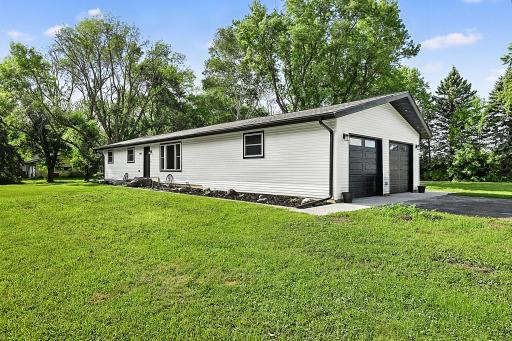 The attached 2 stall garage is 28'x26'. Fresh landscaping and new (2026) gutters around the home ensure the foundation stays dry.