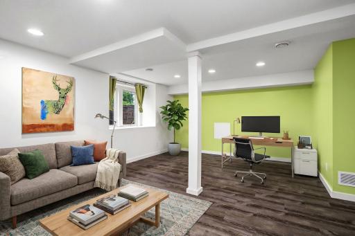 Lower level opens up with oversized egress windows, closets, laundry room and more. This image has been digitally edited.