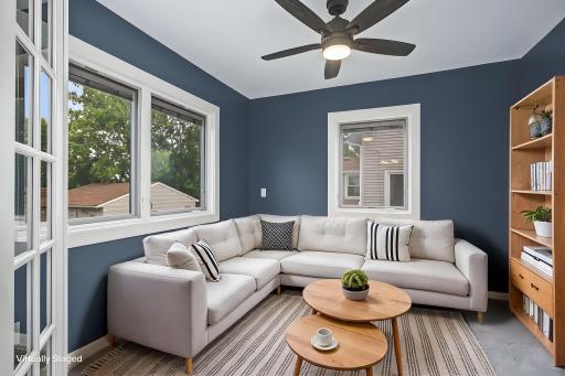 Sunroom on main level can be used for an extra living room, bedroom, office, or dining.