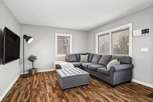 Main floor living room has great layout facing both the front and back entry with visibility to kitchen for open dining.