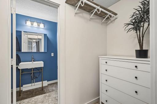 Another view of the primary bedroom walk-through closet.