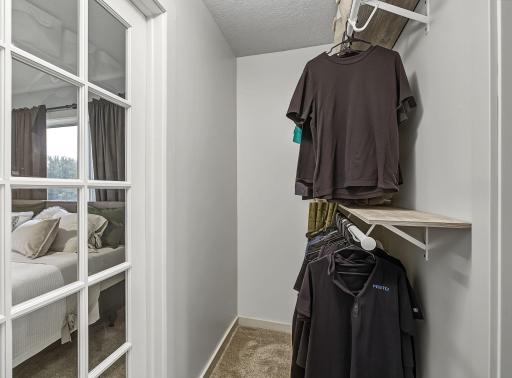Spacious primary walk-through closet.