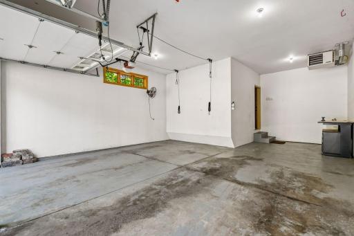Three-car garage (w/ third tandem stall).