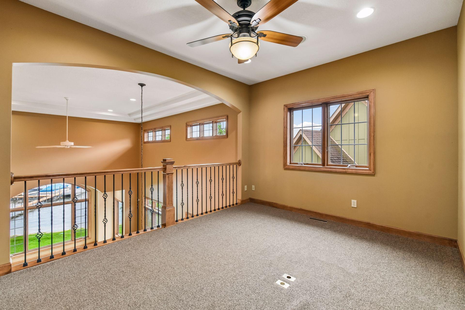 Upper-level loft area overlooking the living room.