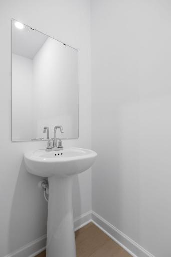 In a discreet location on the first floor is a convenient powder room to accommodate the needs of the whole household and visiting guests.
