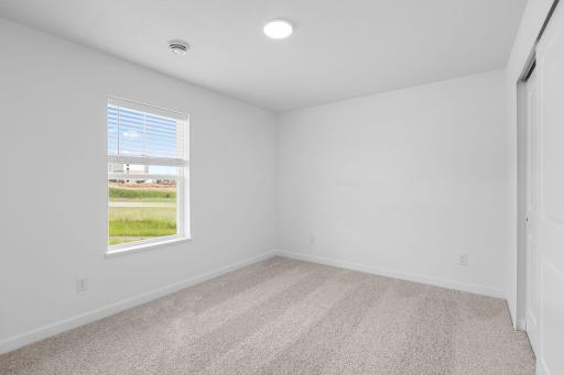 The two secondary bedrooms can be found on the top level to provide a quiet haven away from the bustling downstairs main living area.