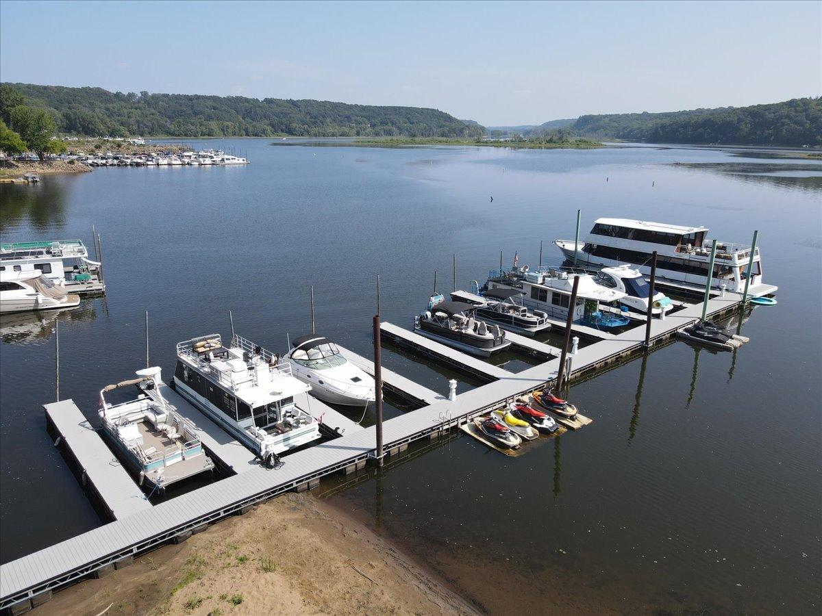 Fabulous dock offers one dedicated boat slip per home. Note the sandy beach, great for launching small watercraft, kayaks, etc.