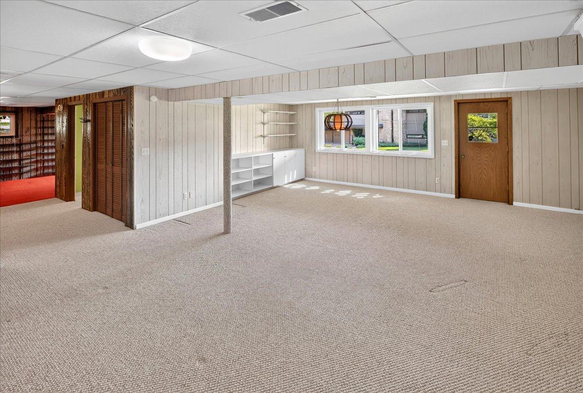 Open and bright lower level features a walkout to the backyard.