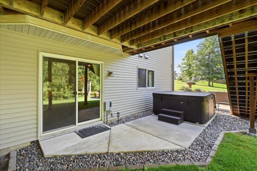 Relax and unwind in the private backyard hot tub.