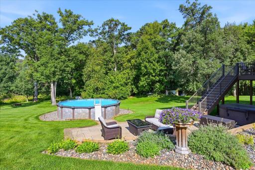 Enjoy peaceful evenings surrounded by mature landscaping.