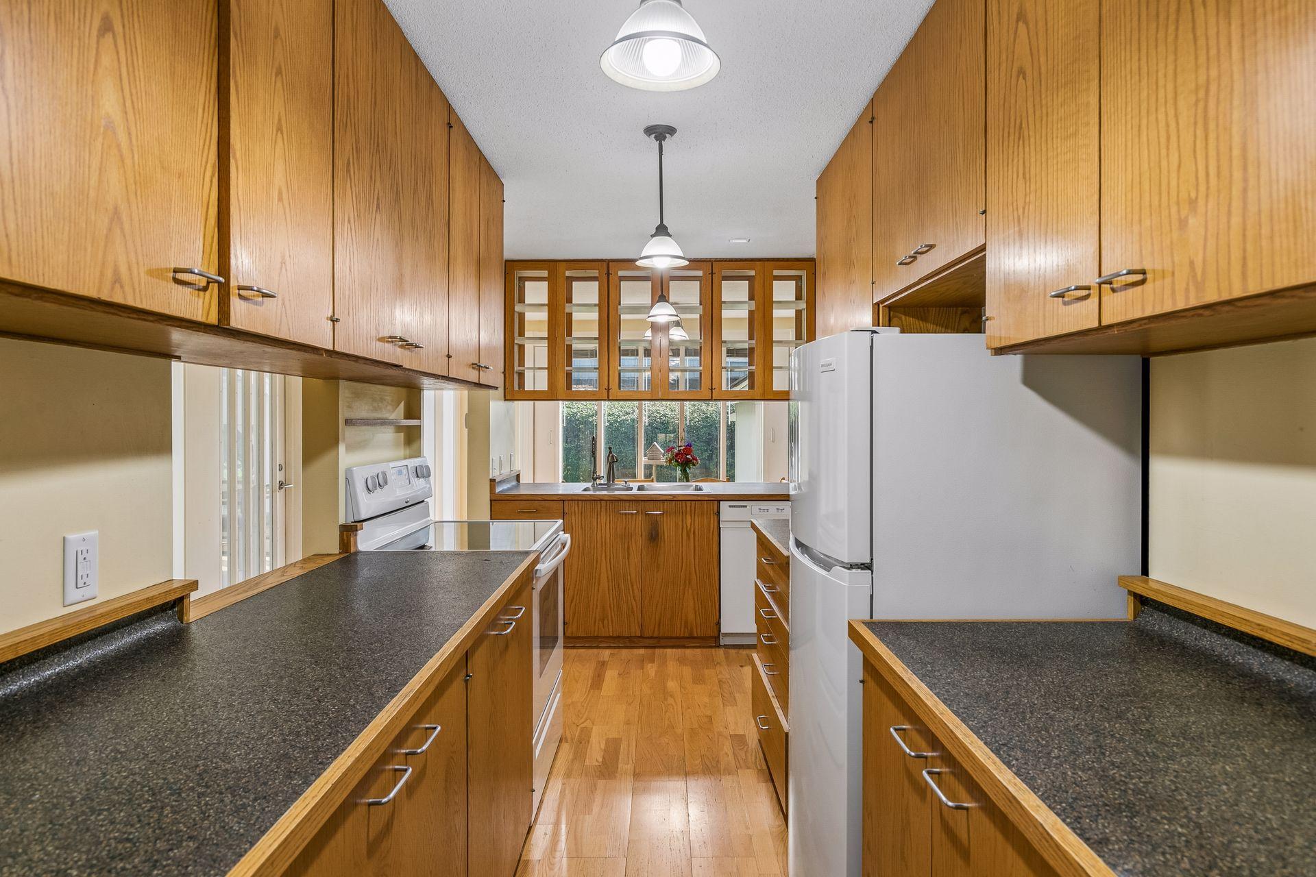 Glass front and back cupboards bring in natural light