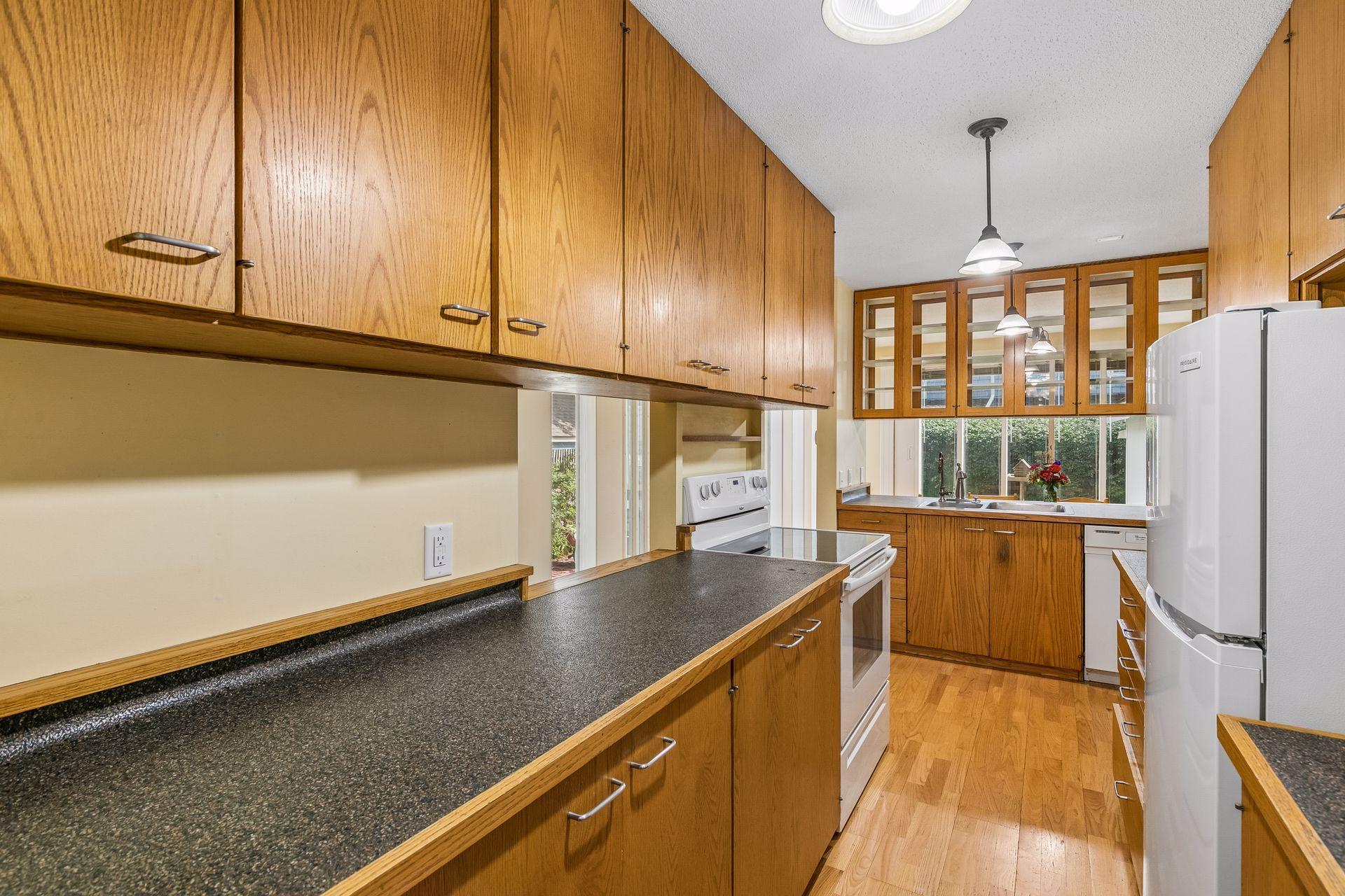Kitchen work space with views to screen porch and backyard