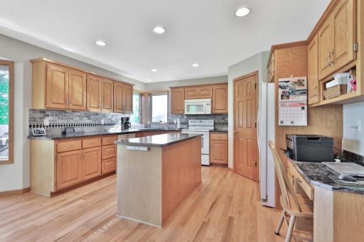 Oak cabinetry with the kitchen center island.