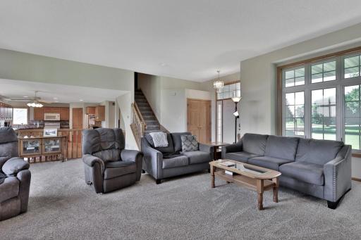 Living room view with stairway to second floor bedrooms.