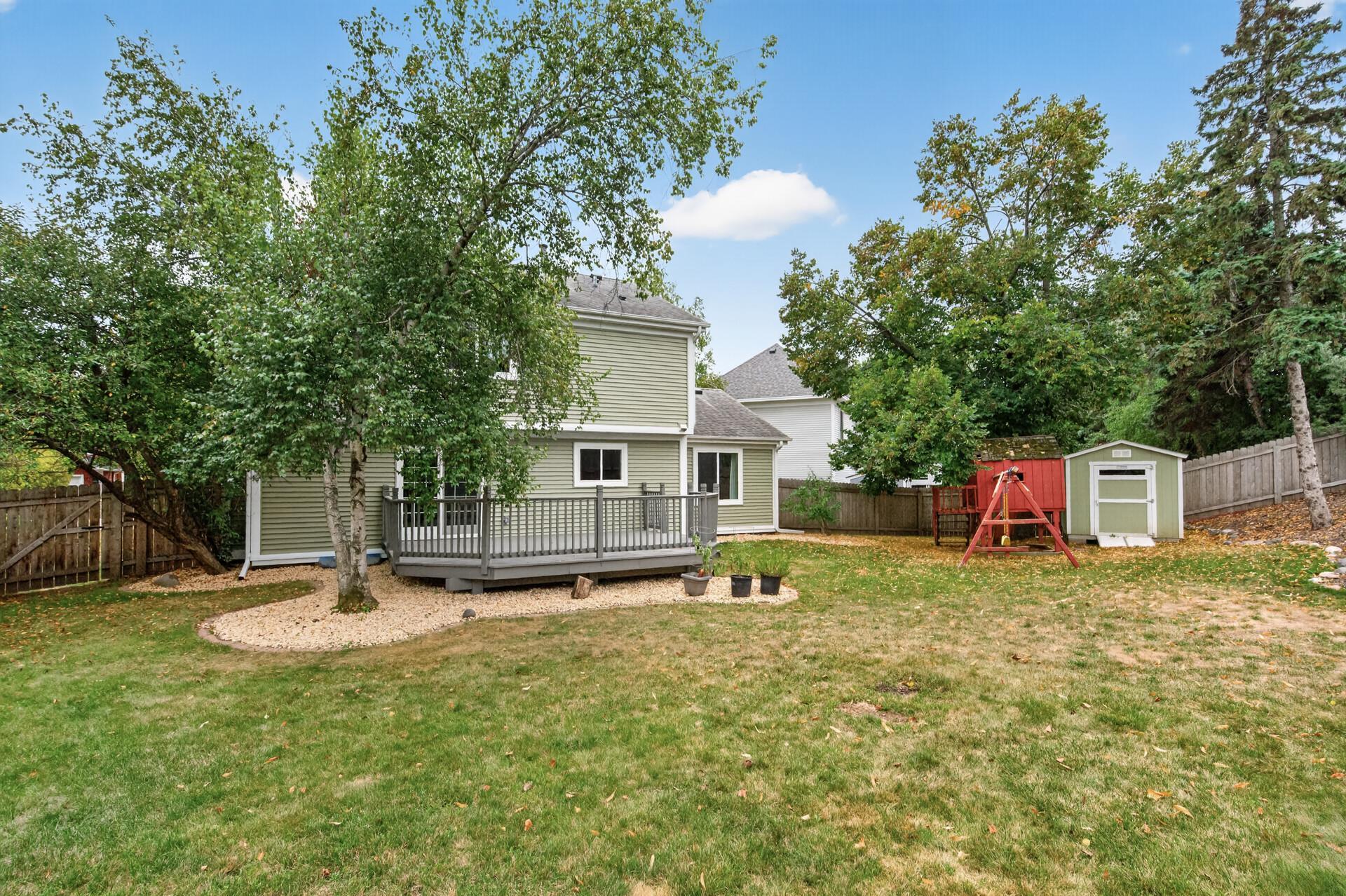 Pie shaped large backyard is fully fenced in with a swingset and 8'x10' shed!shed