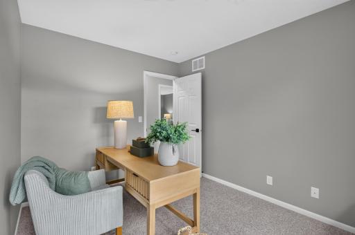 Upper level bedroom that is currently staged as an office
