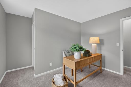 Upper level bedroom that is currently staged as an office