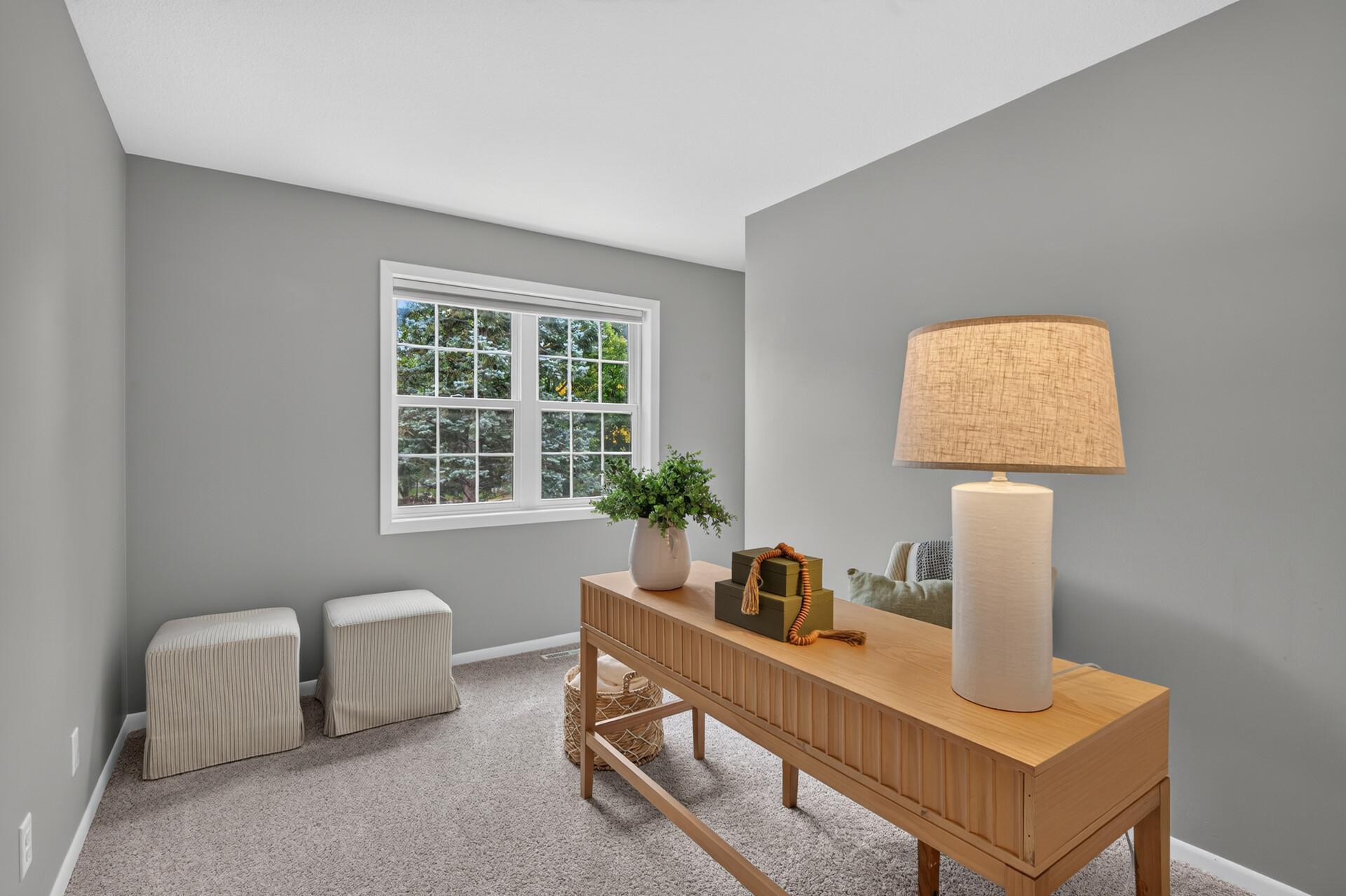 Upper level bedroom that is currently staged as an office
