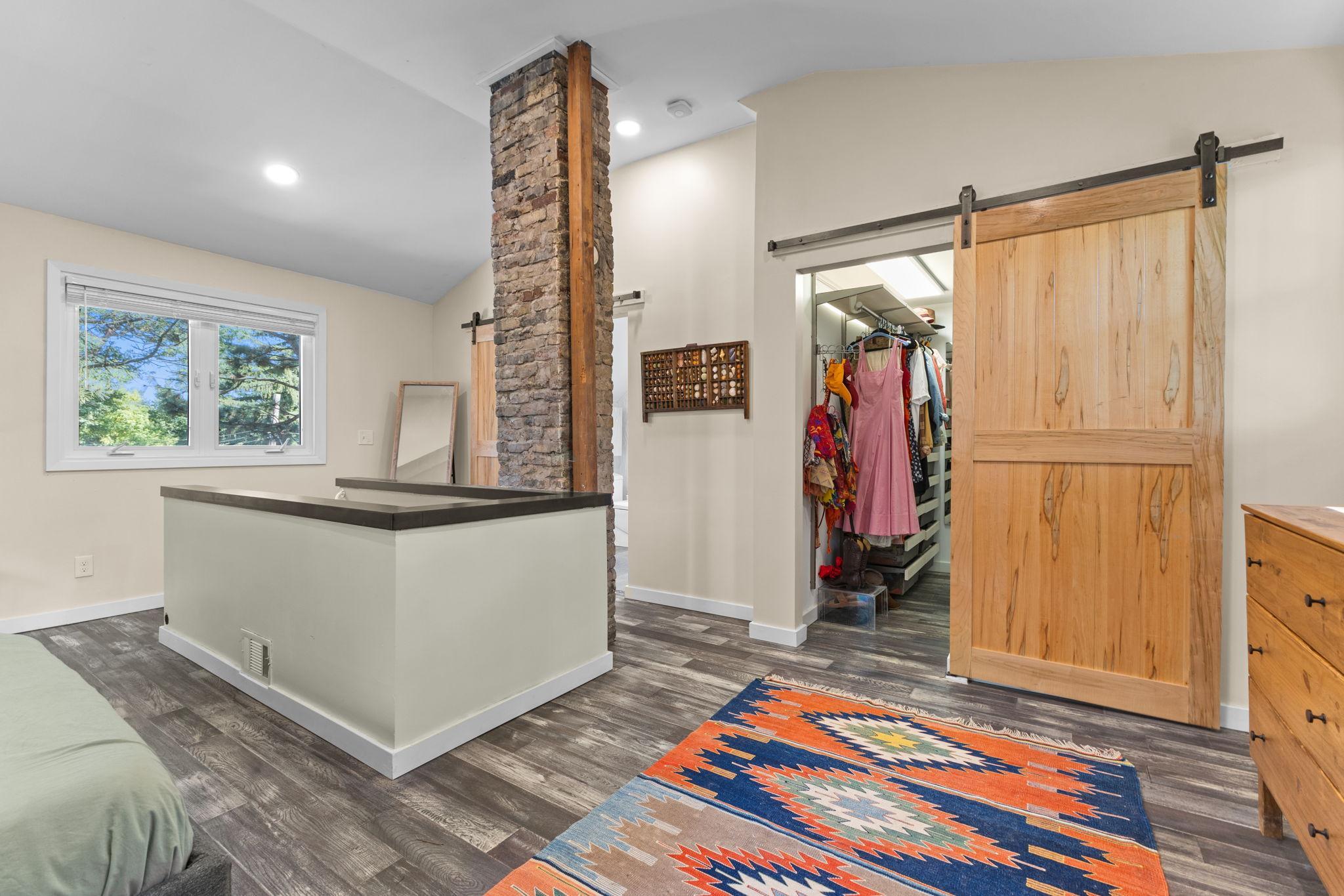 Upper Level Owners Suite- walk-in closet with laundry
