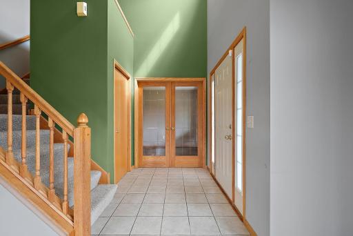 Greet guests in the vaulted foyer