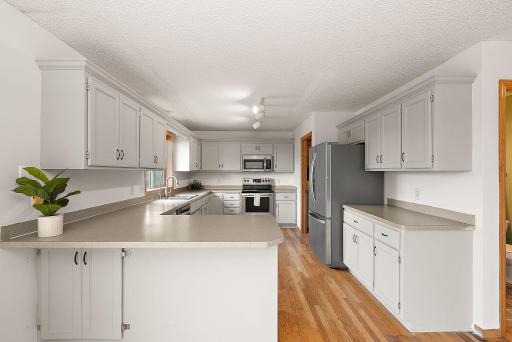 Spacious kitchen featuring generous cabinet storage and counter space