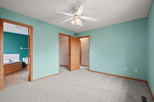 Primary bedroom en suite with walk in closet