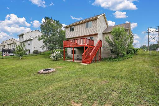 Large deck overlooking spacious fenced in backyard