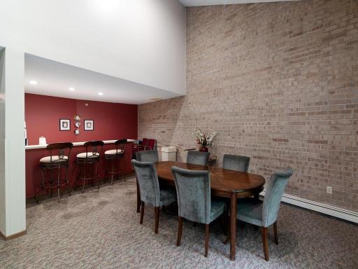 Community party room includes a convenient serving counter and kitchenette for gatherings and entertaining.