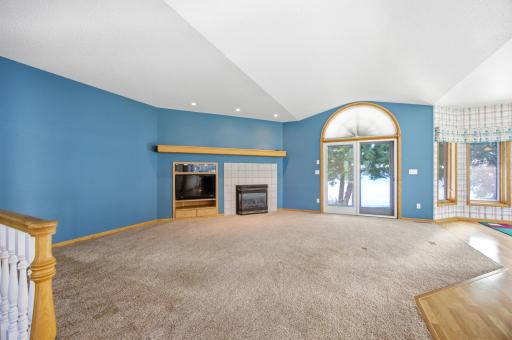 Living room looking out to paver patio on lake side