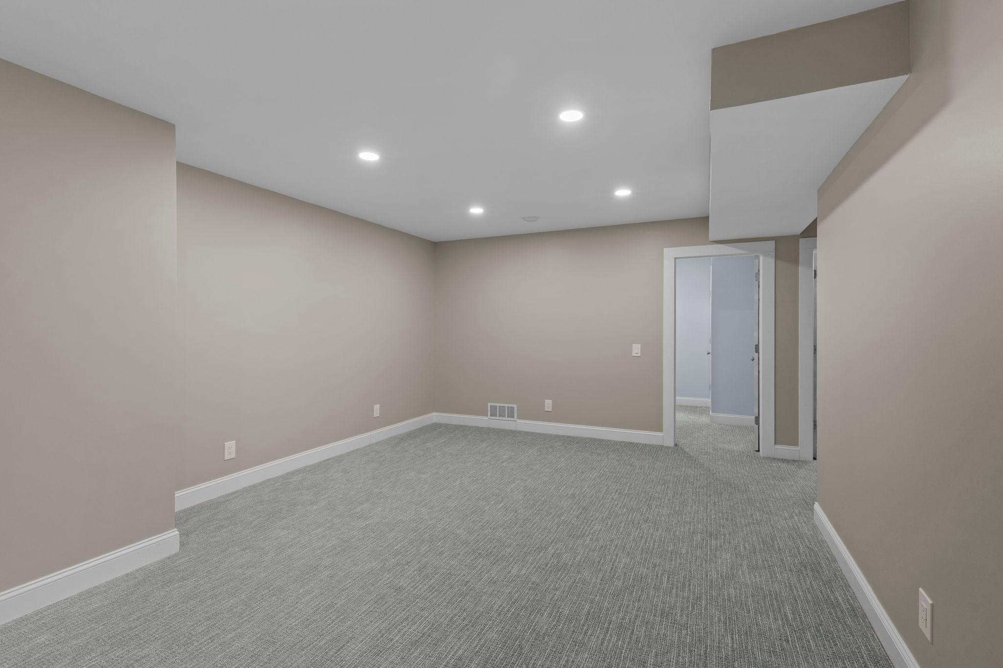 An additional finished lower-level space offers great flexibility for a game room, home gym, playroom, office, or hobby area