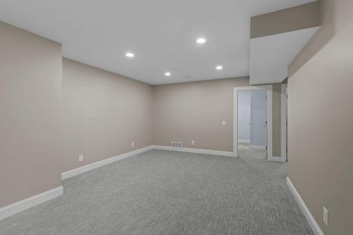 An additional finished lower-level space offers great flexibility for a game room, home gym, playroom, office, or hobby area