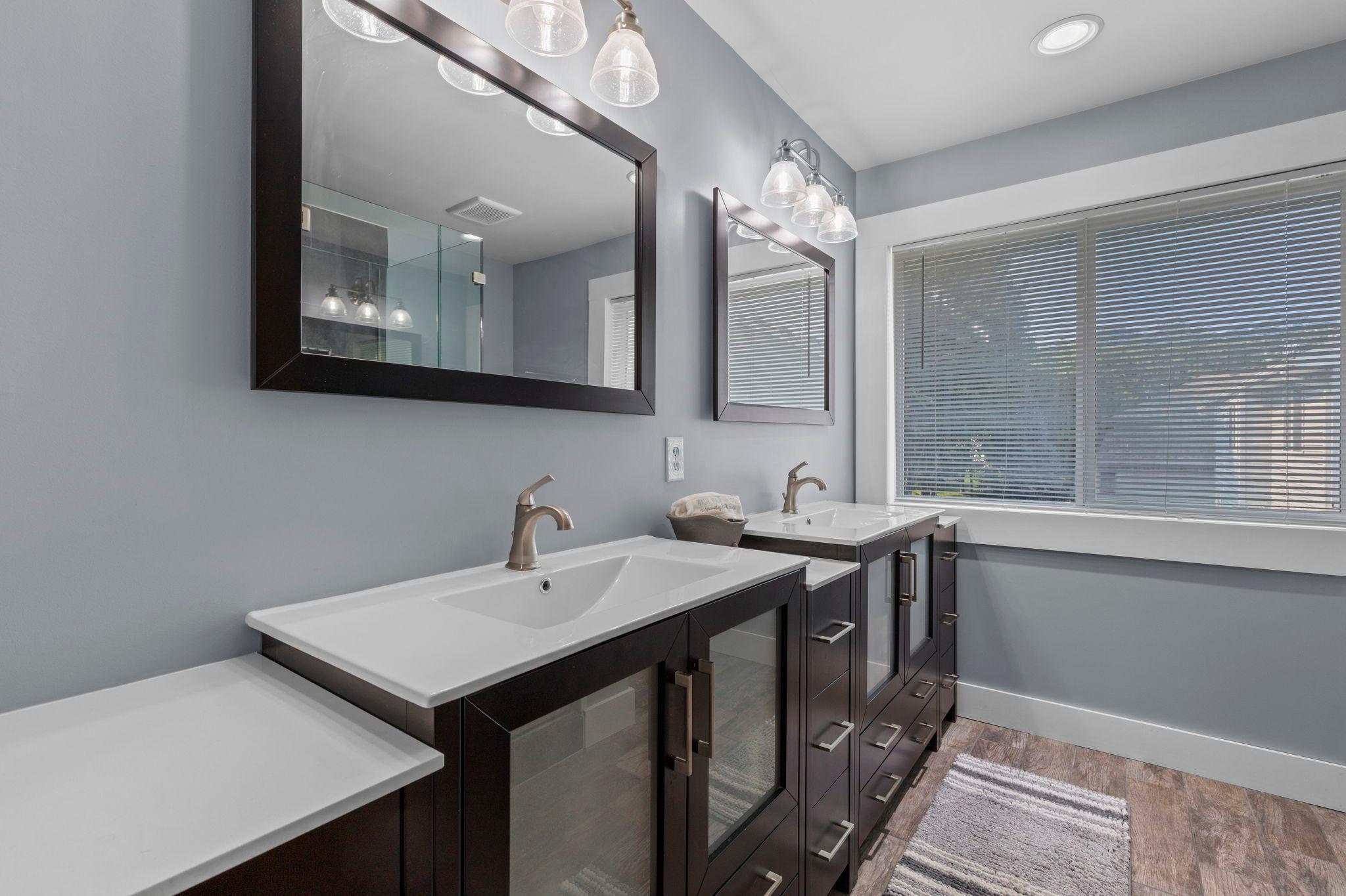 The updated primary bath offers plenty of vanity and storage space