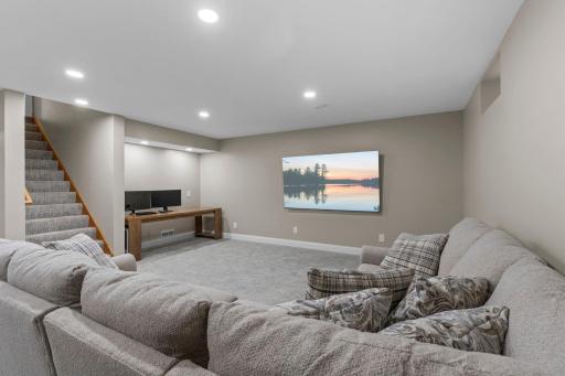 Plenty of room to spread out in the lower-level family room, complete with recessed lighting and fresh, modern finishes