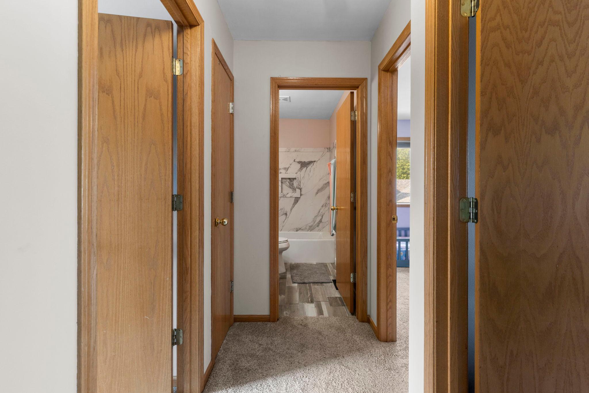 Head upstairs where the home’s thoughtful layout continues with the primary suite, additional bedrooms, and updated full bath
