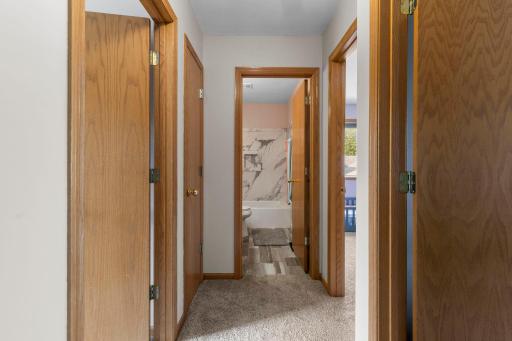 Head upstairs where the home’s thoughtful layout continues with the primary suite, additional bedrooms, and updated full bath