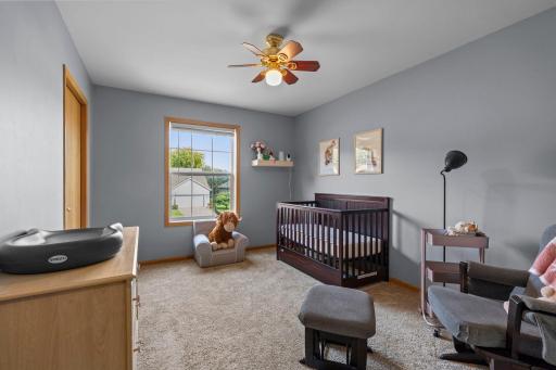 Upper level bedroom 3 is filled with natural light and offering plenty of room for sleep, play, and storag