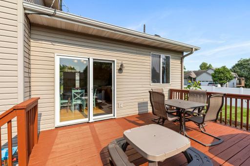 The deck provides plenty of room to relax and enjoy the backyard, with convenient access right off the kitchen and dining area