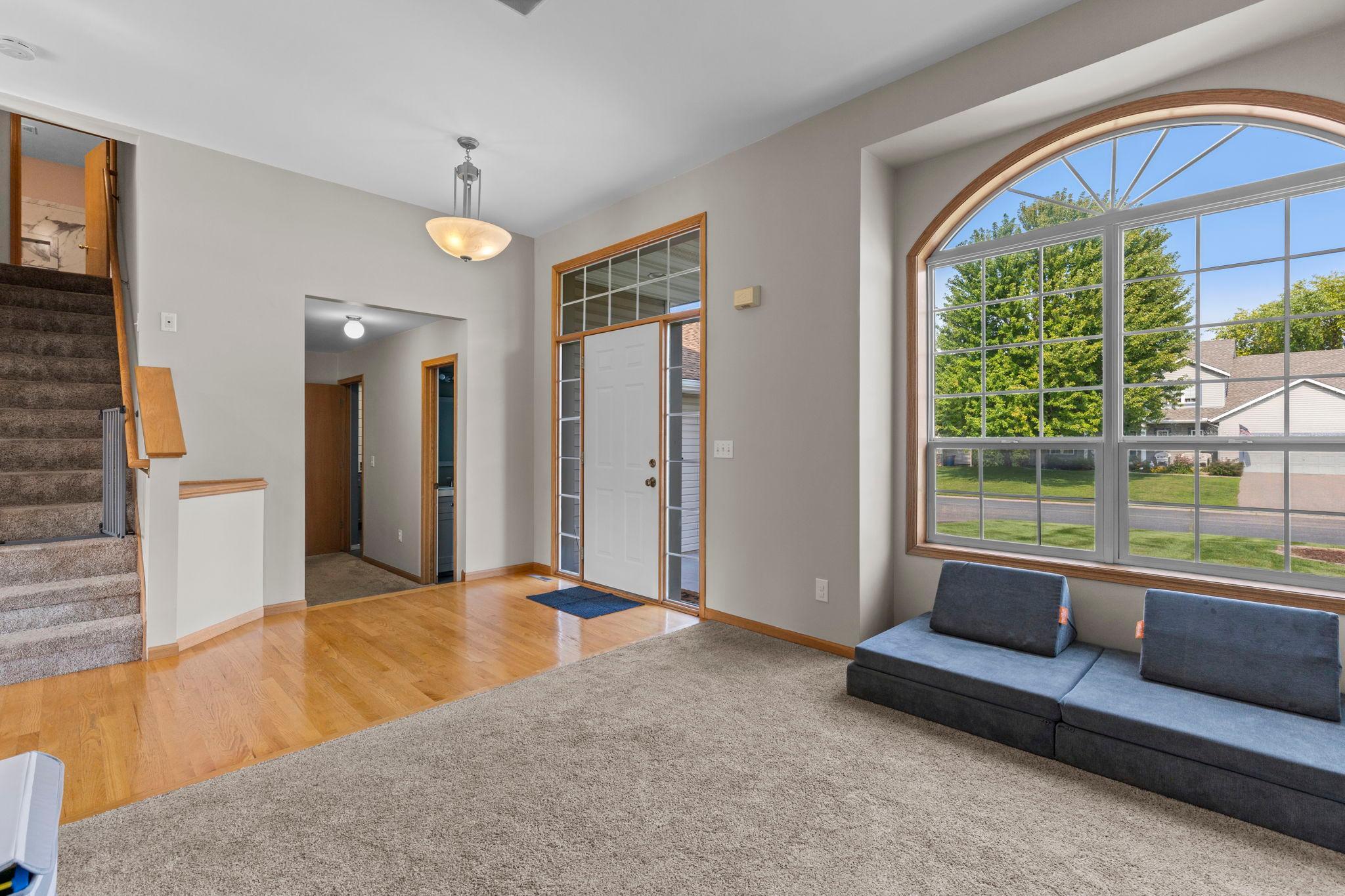 The front living room offers a comfortable space to gather, with an open connection to the rest of the main level