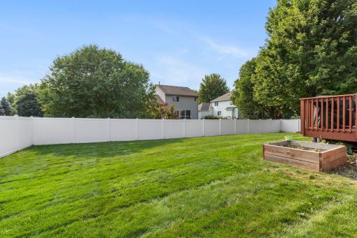 The new privacy fence surrounds a spacious backyard