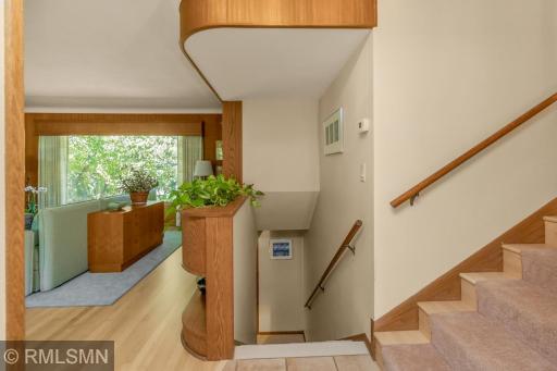 Entryway, with staircases going to upper and lower levels.